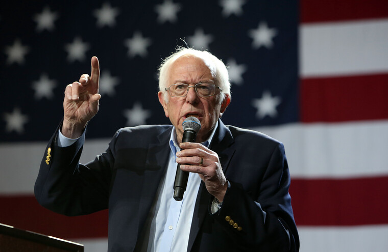 Bernie Sanders in front of the US flag