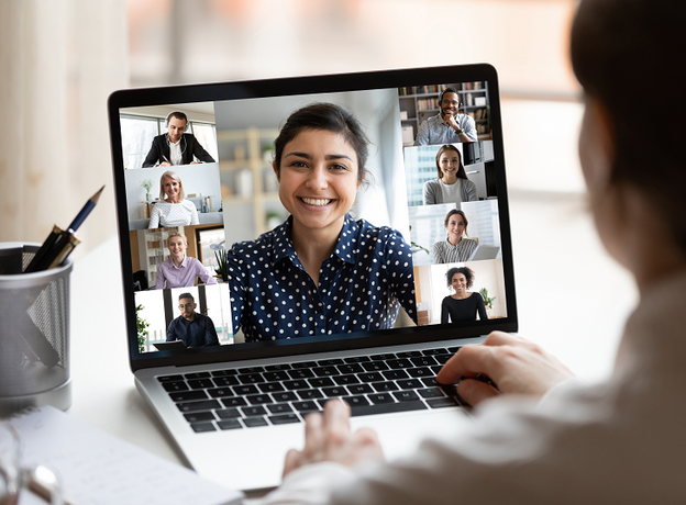 Closeup photo of someone on a zoom call with several other participants