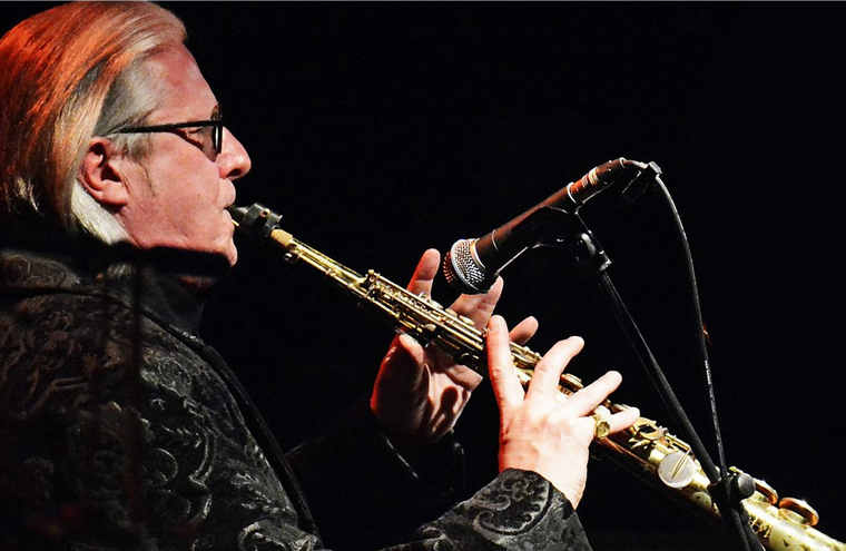 A performer playing an instrument