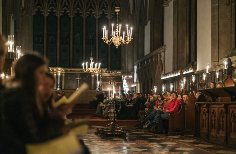 A choir and audience members in a cathedral